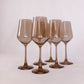 six brown colored wine glass