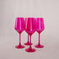 four hot pink wine glasses